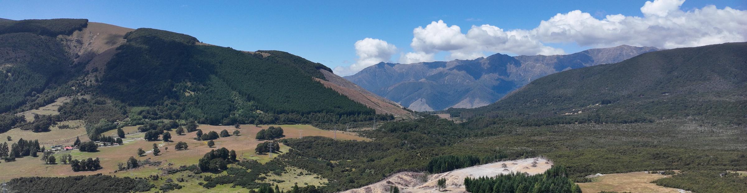 Valley in the Nelson Lakes district with a plantation block on the hillside and the ranges beyond